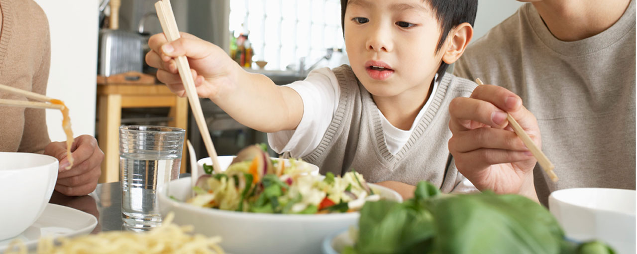 Boy getting salad